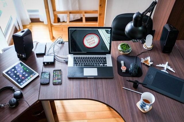 desk covered with devices