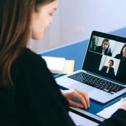 Woman attending a video meeting on her laptop.