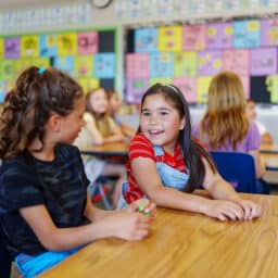 Young Girls Talking in the Classroom